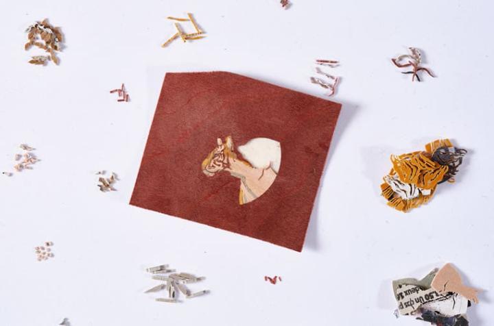 爱马仕共使用290枚来自不同木材的薄片，镶嵌出面盘上的老虎图案。