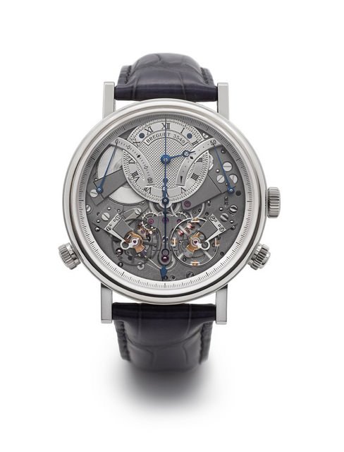 宝玑传世系列Tradition Chronographe Indépendant 7077计时码表搭載Cal. 580DR机芯，表壳为18K白金，表壳外缘饰有钱币纹