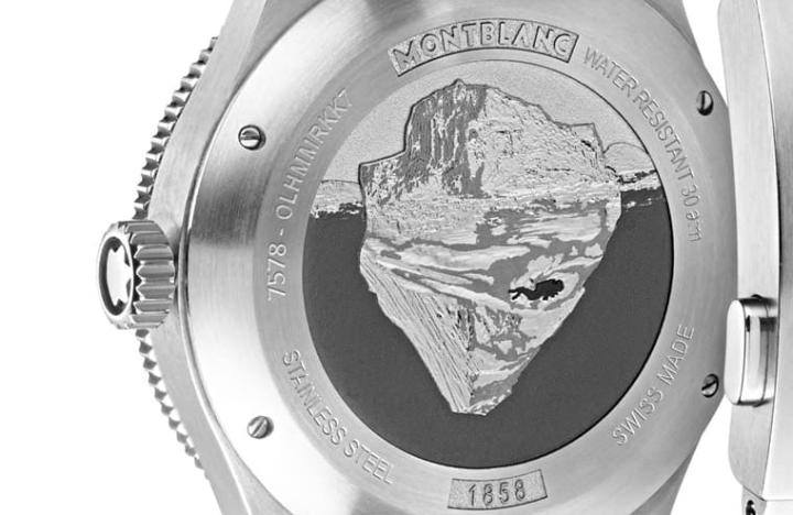 表背镌刻冰山与探索下方冰河水域的潜水者图案，虽然无法一窥机芯样貌，但金雕细致的模样强烈呼应手表设计主题，散发手表的专属个性。